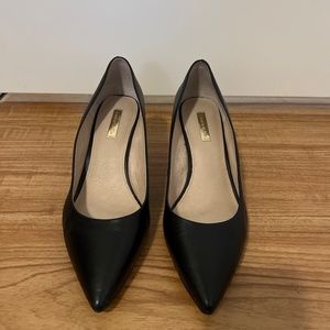Black leather pumps